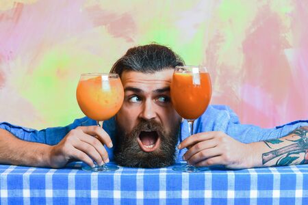 Bearded man, long beard. Brutal caucasian surprised hipster with moustache in denim shirt between...