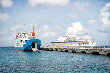 Cozumel, Mexico - December 24, 2015: large cruise ship or liner in bay or harbor, touristic passenger boat on calm water summer day on cloudy blue sky backgroundのeditorial素材