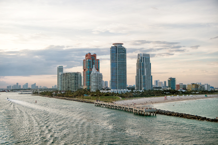 South Miami Beach. Miami skyscrapers with blue cloudy sky,white boat sailing next to Miami downtown, Aerial viewの写真素材