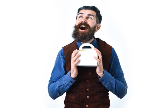 bearded man, long beard, brutal caucasian hipster with moustache holding lunch box with happy face...