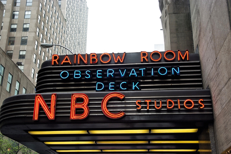 New York, USA - November 13, 2008: entrance marquee of nbc television studios building with billboards and grey skyscrapers on white sky background. Entertainment and tourist destinationのeditorial素材
