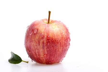 apple red color with water drops isolated on white backgroundの写真素材