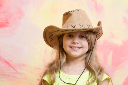 cowgirl. little girl in cowboy hat on colorful background, copy spaceの写真素材