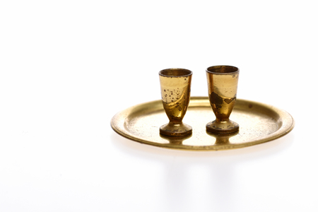 goblets on golden tray isolated on white background. Antique concept, copy spaceの写真素材