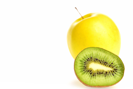 Kiwi fruit and green apple isolated on white background, copy space and selective focus. Healthy food and lifestyle conceptの写真素材