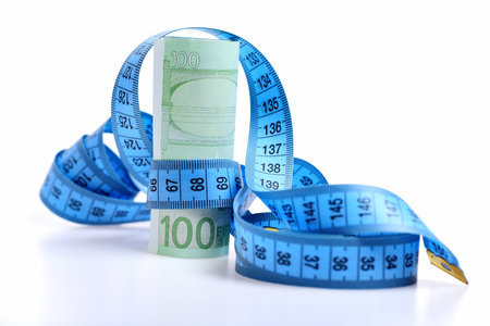 centimeter with euro banknotes isolated on white backgroundの写真素材