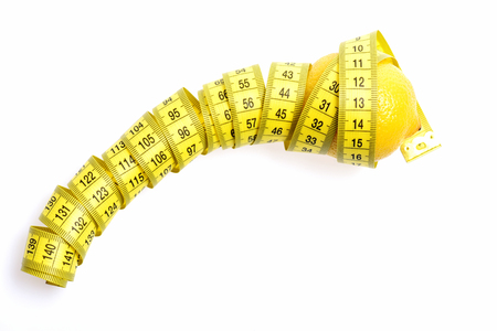 tape-measure twined around lemon isolated on white background, copy spaceの写真素材