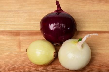 onion on brown wooden background, cooking conceptの写真素材