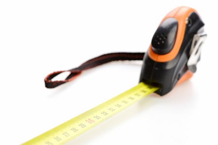 Ruler with belt clip and self retracting mechanism isolated on white background, selective focusの写真素材