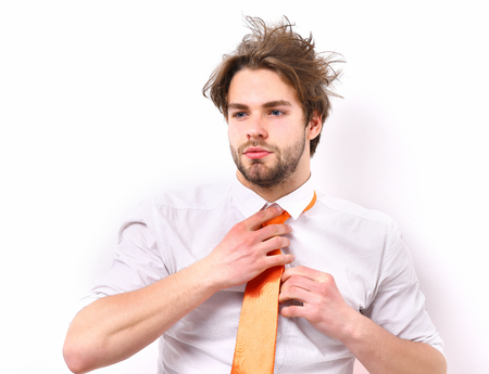 Bearded man, short beard. Caucasian serious macho with moustache and ruffled hair have acid orange tie on white shirt isolated on white studio background, office worker conceptの写真素材