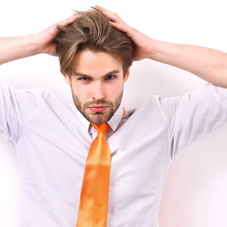 Bearded man, short beard. Caucasian serious macho with moustache have acid orange tie on white shirt isolated on white studio background, office worker conceptの写真素材