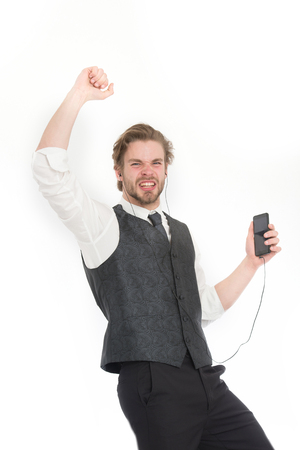 Manager with beard on singing face. Headset and mp3. Fashion and new technology. Man in formal outfit with mobile phone. Businessman or ceo listen music.の写真素材