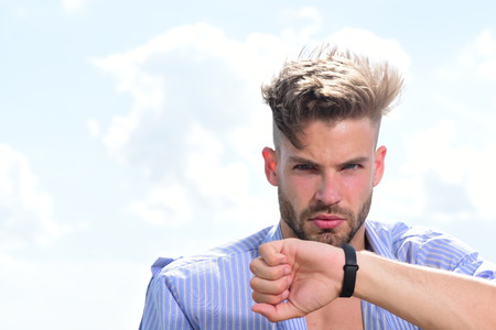 Bearded attractive guy enjoy healthy morning. Sexy young macho on the sky. Morning concept. Male model posing against the sky. Adult handsome man in fashionable shirt.の写真素材