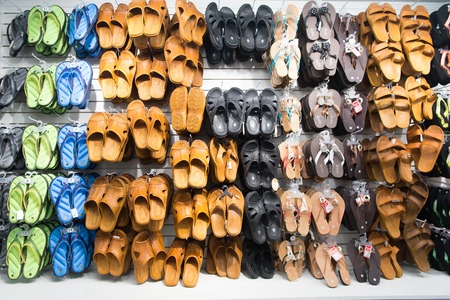 Key West, USA-december 26. 2015 : Rubber sandals on shop display , shopping . Assortment of male and female shoes of different colors. Pool or beach slides. Summer vacation concept. Recreationのeditorial素材