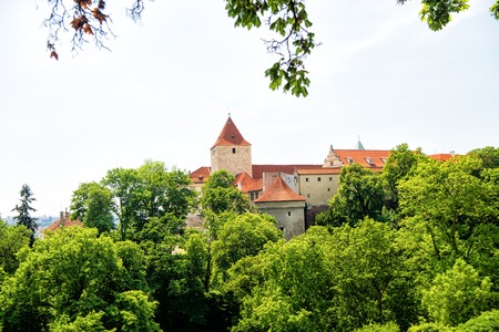 Bastion castle with towers in Prague, Czech Republic, with green trees garden on sunny summer day on blue sky. Travelling, wanderlust, vacation concept.のeditorial素材