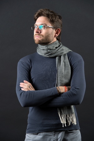 Vision, business, future concept. Man in scarf and sweater with folded hands. Fashion, eyewear, accessory. Businessman in glasses on bearded face. Eyesight correction, eye care, health.の写真素材