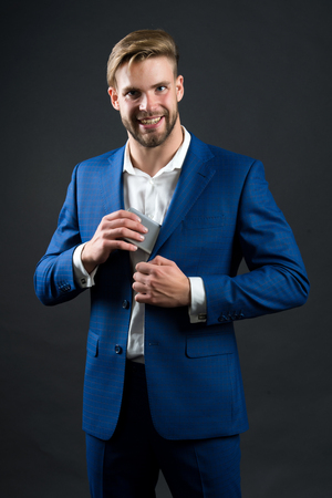 Business communication and modern life. man in formal outfit with mobile phone. Manager with beard on happy face hold phone. Businessman or ceo fashion. digital marketing and new technology.の写真素材