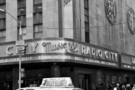 New York, USA - November 13, 2008: corner of radio city music hall, theater building, modern architecture with billboards on grey background. Entertainment and tourist destinationのeditorial素材