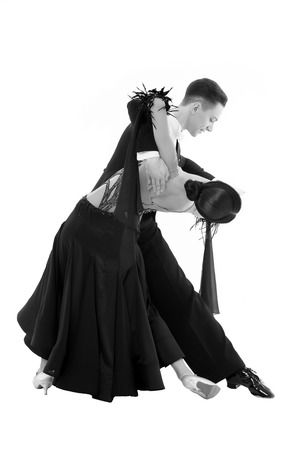 ballroom dance couple in a dance pose isolated on white background. ballroom sensual proffessional dancers dancing walz, tango, slowfox and quickstepの写真素材
