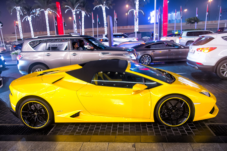 DUBAI, UAE - december 23, 2017: luxury Supercar Lamborghini huricane yellow color parked next to Dubai mall. Lamborghini is famous expensive automobile brand carのeditorial素材