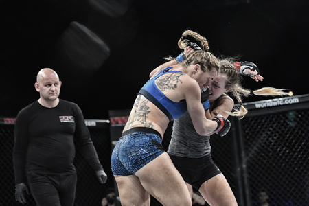 Kyiv, Ukraine -March 13, 2017: mma female fighters fight at the ring fight at the championship in Palace of sport in Kiev, Ukraine powerfuf girls or women fighters fight for mma champions beltのeditorial素材