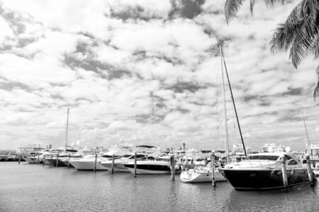 View of luxurious boats and yacht docked in a Miami Beach Marinaの写真素材