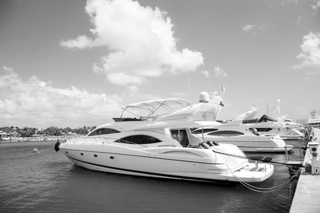 luxury yachts docked in the port in bay at sunny day with clouds on blue sky in La Romana, Dominican Republicの写真素材