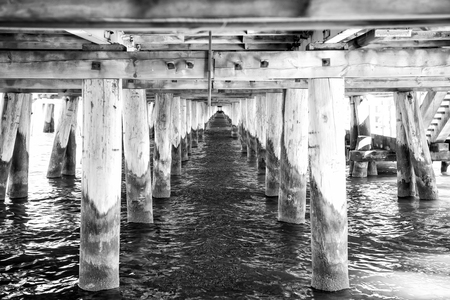 under view on wooden construction of wood bridge with water outdoor as natural backgroundの写真素材
