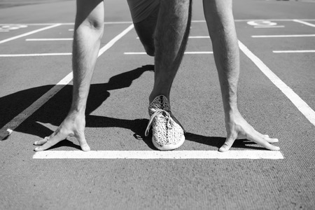 leg of man man start competition running at arena track sunny summer outdoor, workout and health, sportの写真素材