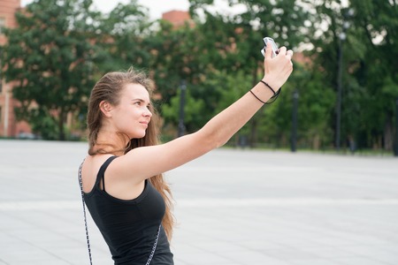 Sensual woman make selfie with camera outdoor, vacation. Girl with long hair, no makeup, beauty....