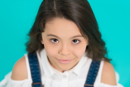 Skincare, skin care, beauty, look concept. Girl child with young skin, skincare on blue background