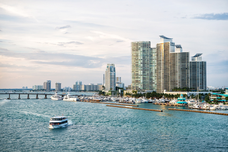 Miami, USA - March, 18, 2016: downtown skyline on sea shore. Skyscraper building on cloudy sky. Architecture, structure, design. Building, construction, development.のeditorial素材