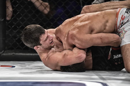 Kyiv, Ukraine -March 13, 2017: mma fighters fight at the ring fight at the championship in Palace of sport in Kiev, Ukraineのeditorial素材
