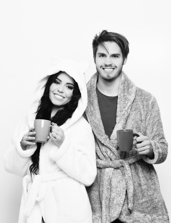 lovely smiling happy couple holding cupsの写真素材