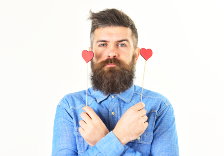 Brutal man with long beard and red hearts.の写真素材