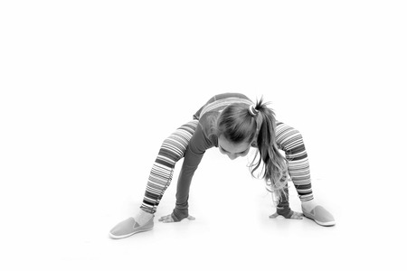 Sport and success. Fitness and health. Child in pink sportswear. Workout of small girl isolated on white background. Education and energy.の写真素材