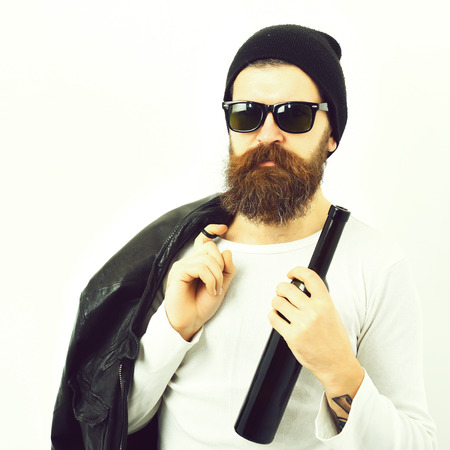 Bearded brutal caucasian hipster holding bottleの写真素材