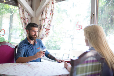 Couple in love drinks wine in cafe or restaurantの写真素材