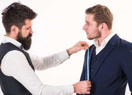 Sewing exclusive clothes concept. Businessman, client on strict faceの写真素材