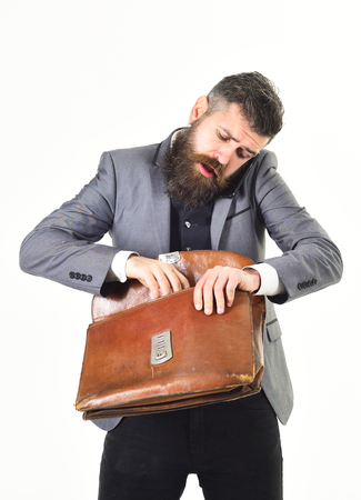 Lawyer with beard wearing smart suit and talking phone.の写真素材