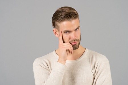 Man with beard on thinking face. Bearded man with blond hair. Skincare and barber salon. Fashion...