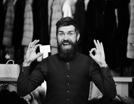 Shopping man. Credit card. Finance and shopping concept. Guy with beard and business card.の写真素材