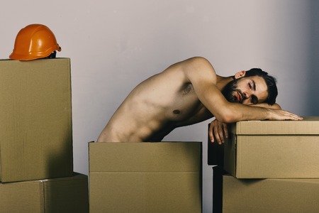 Dear boy. Sugar boy. Sexuality and building concept: guy with sexy torso restingの写真素材