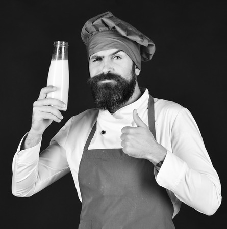 Chief cooker or chef. Chef with milkshake or yoghurt. Cook with confident faceの写真素材