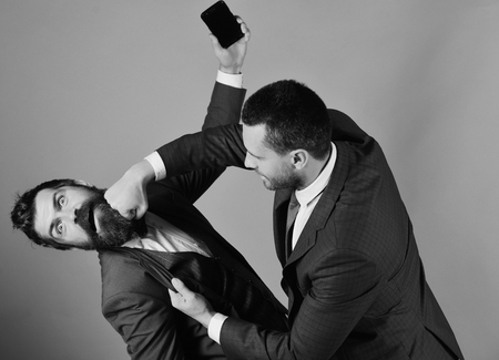 Business brouken. Men with beards fight on red background.の写真素材