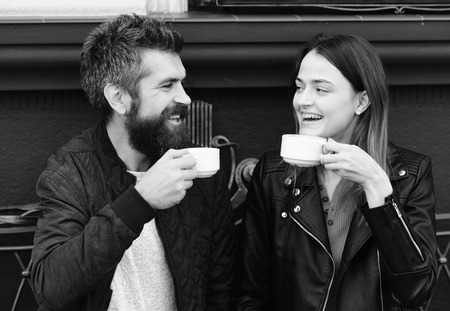 Couple in love drinks coffee break. Hot beverage and lunch. Woman and man with happy faces