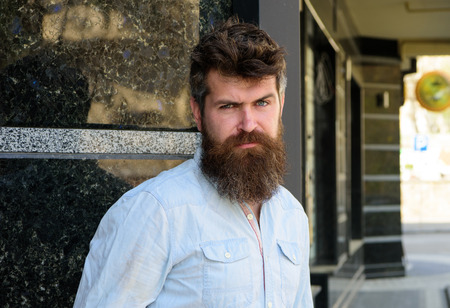 Man with beard and mustache on strict, serious or disgusting face, black marble background....