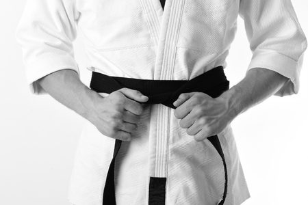 Karate boy. Male torso and sportive arms on white backgroundの写真素材