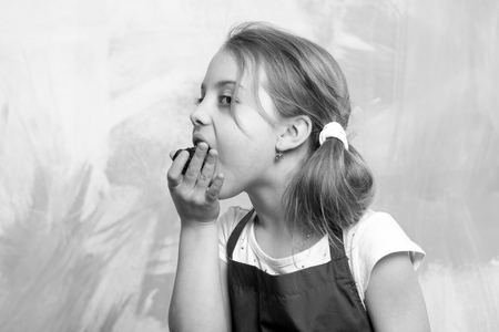 Kid in cook apron.の写真素材