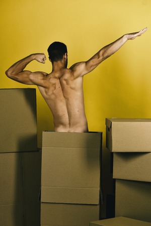 fast delivery. Guy with strong sexy back pretending to fly like superheroの写真素材